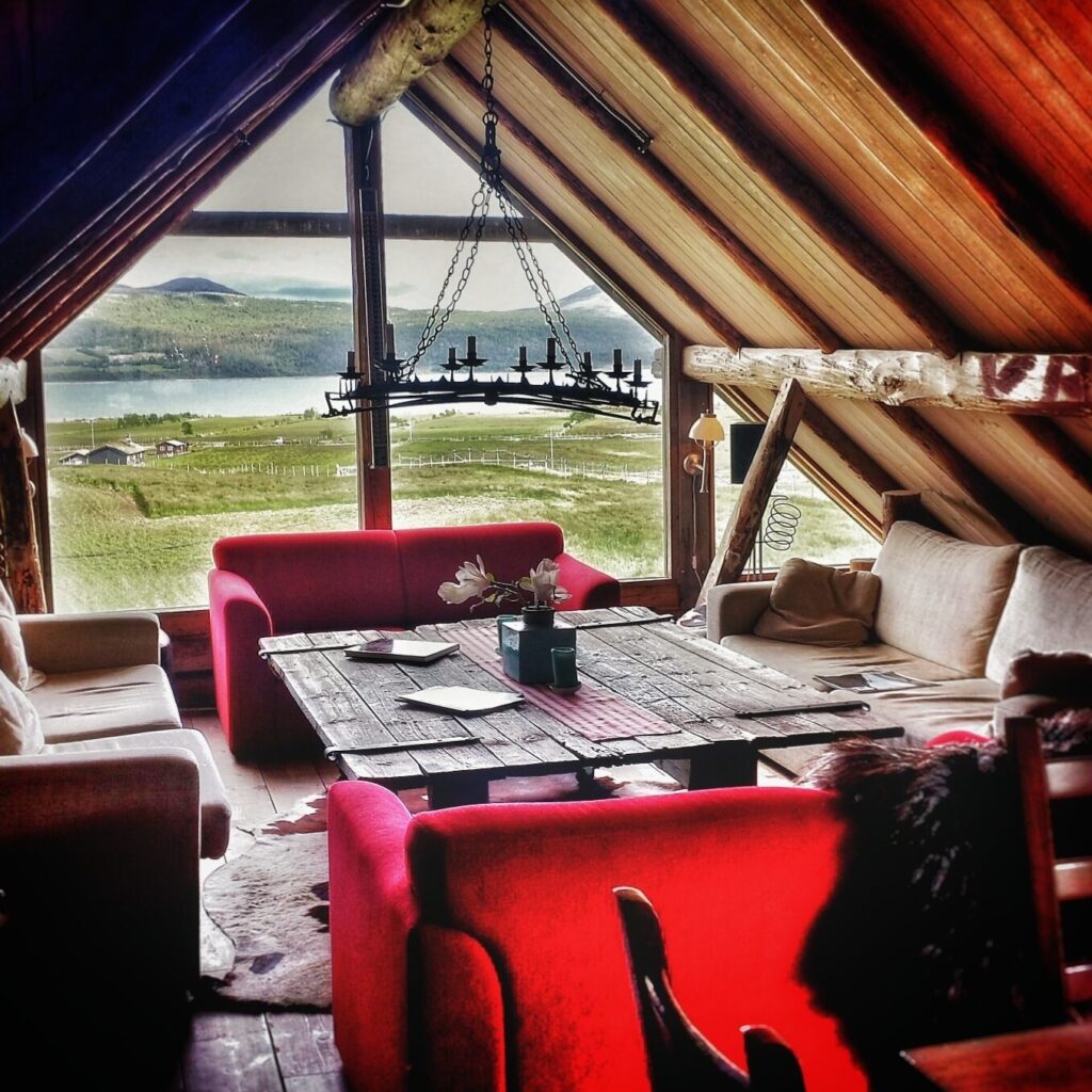 Overview picture from the sofa corner up in the barn, with a view of the beautiful landscape from the large window.